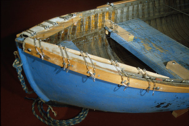 blue dinghy - front showing piano tuning pins strung with piano wire