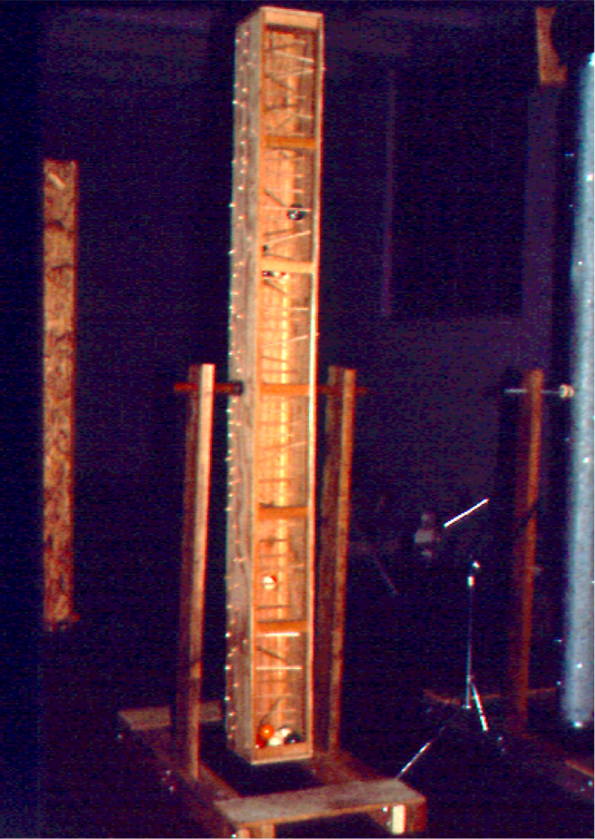 Palo de lluvia (rain stick): plywood, dowels, plexiglas, & billiard balls mounted to rock or spin.