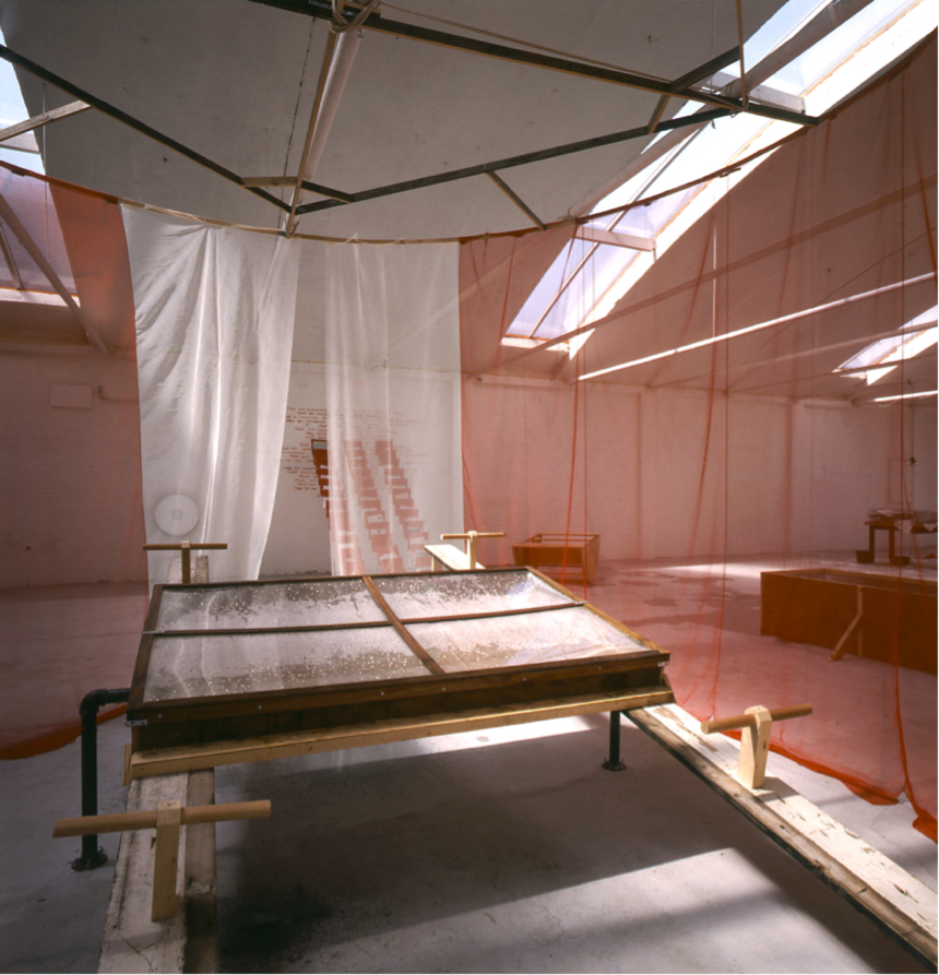 Double see saw inside a round curtained space hung with translucent fabric for walls