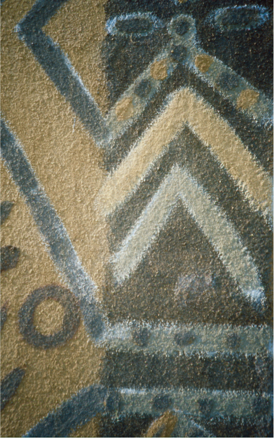 Detail showing layers of dirt painted in a pattern of a chevron, stripes, and dots.