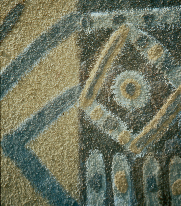 Detail: layers of dirt painted in geometric shapes - dots, circles, stripes, diamond.