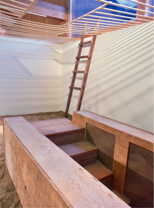 Stairs descend under ground, ladder ascends to top of wall.