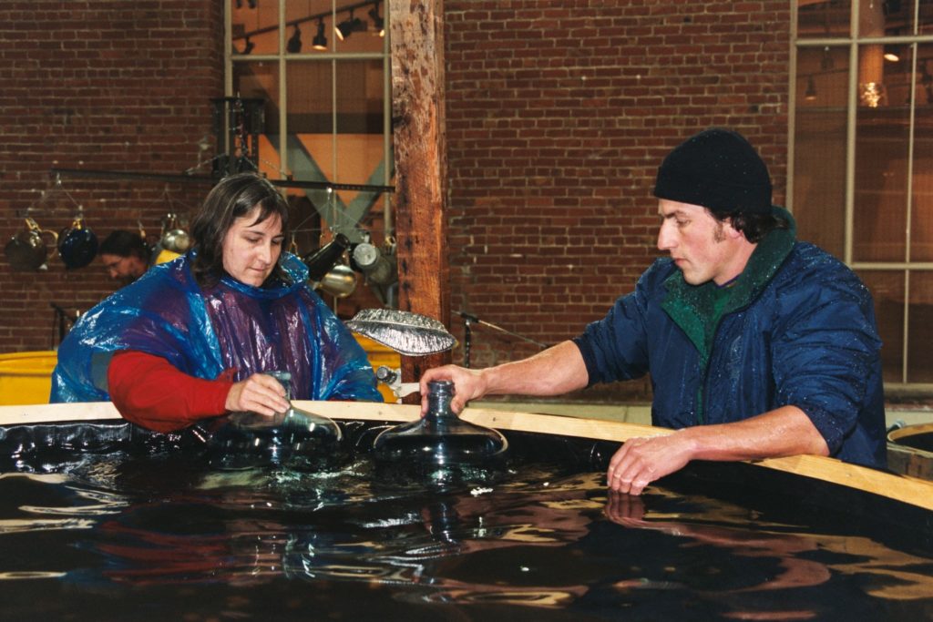 playing the tops of water bottles