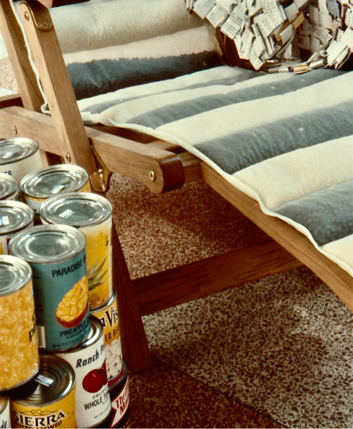 Detail: canned pineapple, tomatoes and beans adorn the base of the umbrella.