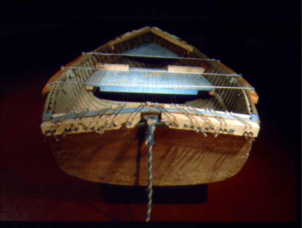 Blue boat - rear showing piano tuning pins and wire slipped through plastic tubing