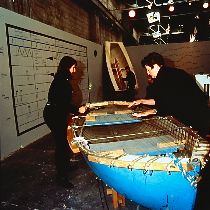 Judith and Marilyn perform on the blue dinghy strung with piano wire