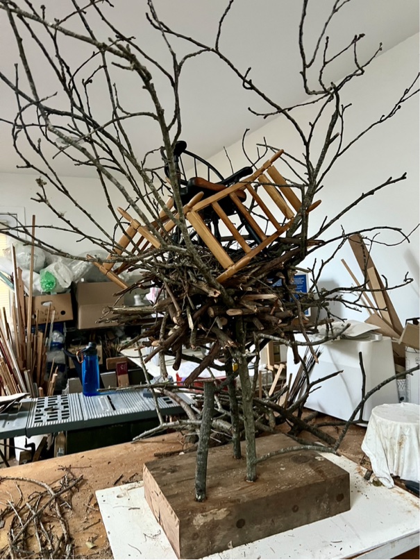 tabletop sized nest sculpture with toy-sized furniture