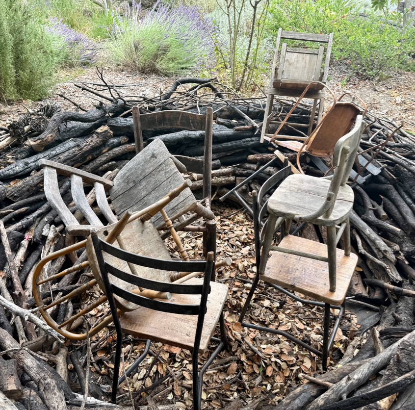 detail view of children's chairs stacked in center